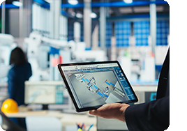 engineer in factory holding tablet