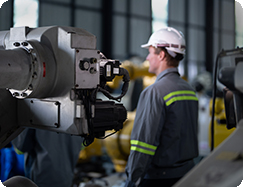 Engineers check control heavy machine robot arm