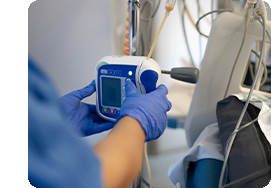 nurse working with fusion pump